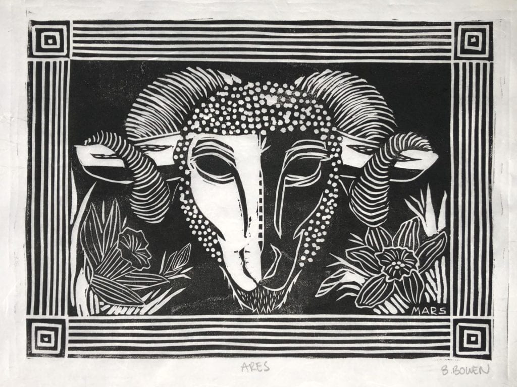 Linocut print in black ink on white paper of a ram's head with curly horns. Daffodils in the lower corners. The border resembles Roman columns.