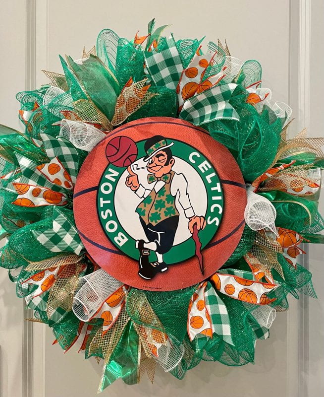 A 24" round green and white wreath with a basketball Boston Celtics logo in the center.