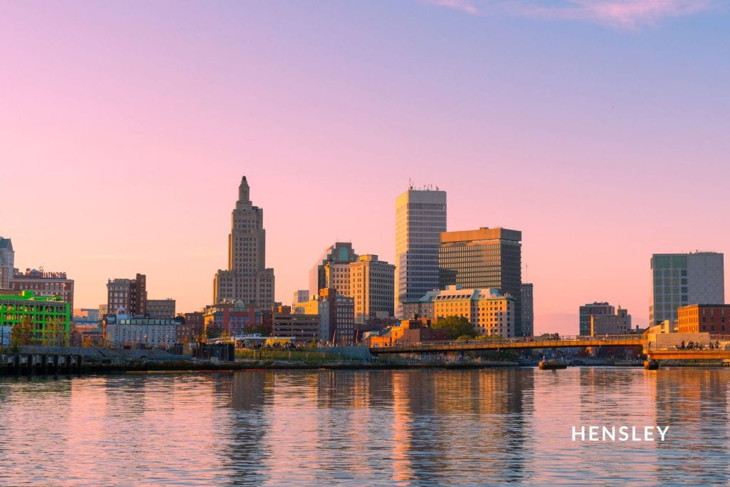Providence, Rhode Island city skyline during golden hour with a pink-ish blue sky.