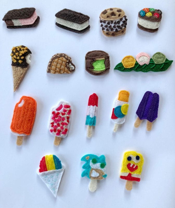 Colorful ice-cream shaped patches on a white background: Neapolitan ice cream sandwich; vanilla ice cream sandwich; Chipwich; vanilla M&M cookie sandwich; Drumstick ice cream cone; Choco Taco; mint It’s-It; mango, strawberry, and green tea mochi ice cream; orange Creamsicle; strawberry shortcake bar; firework popsicle; orange push-up popsicle; grape “twin” popsicle; red, yellow, and blue snow cone, Sonic the Hedgehog with misaligned gumball eyes; and Spongebob Squarepants with misaligned gumball eyes.