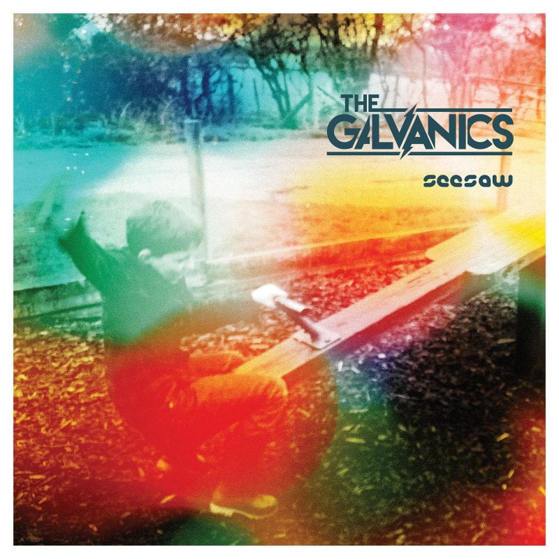 Cover art for the Galvanics’ Seesaw EP, which feaures an image of young child on a playground underneath a layer of swirling colors