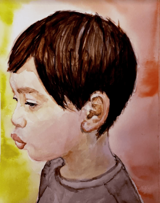 Close-up of a child’s profile whose lips are sealed in a duckface. Their demeanor alludes to being serious. Their hair is short, dark, and straight. There are wearing a gray t-shirt and they are against a mustard yellow and orange faded background.
