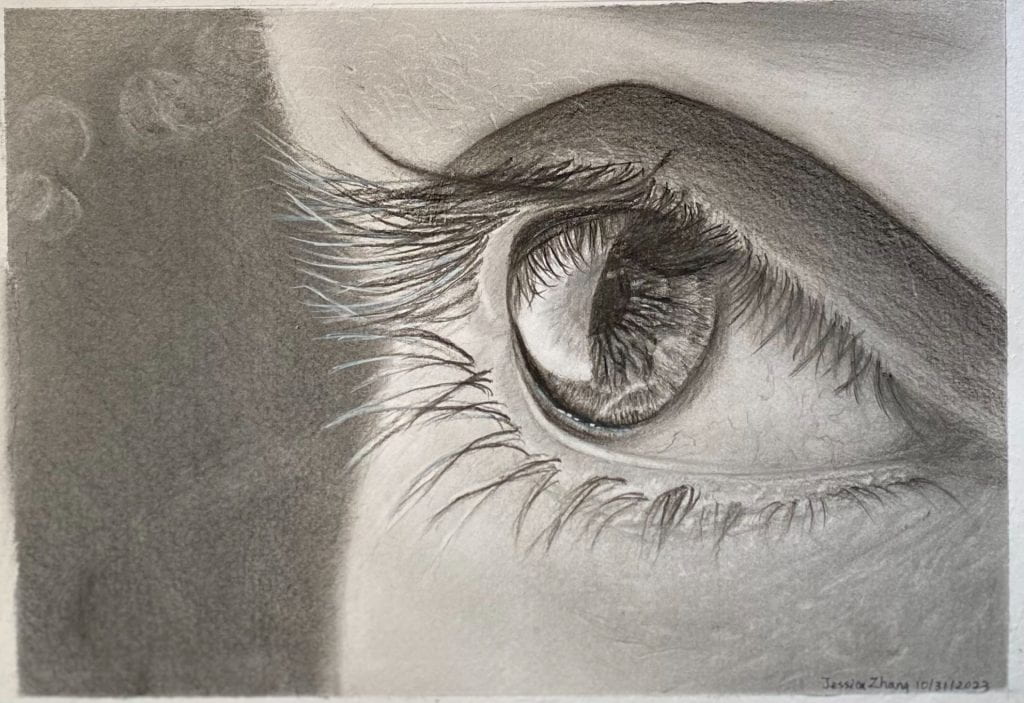 Sketch of one human eye in greyscale, gazing towards the right. Close-up, with strokes revealing long dark eyelashes, their reflection inside the pupil, and the tiny veins inside the white of the eye. Part of the pupil glows, reflecting the light that it receives.