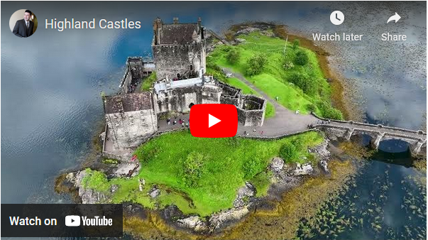 Thumbnail of video with the YouTube red and white play button in the center and front and a still showing from above a stone-walled fortress on a green island.