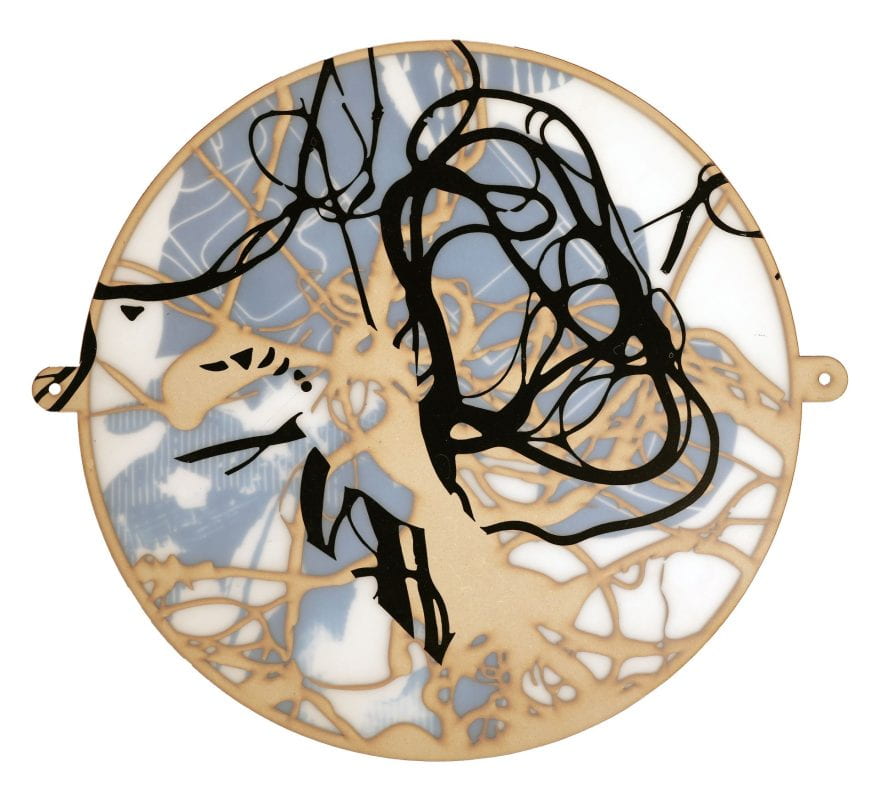 Two-dimensional abstract mixed media artwork. Swirls of black and beige give an abstract shape to a round emblem with stuttered grey panels. Looks like a belt clasp or a necklace pendant, since it has one small hole in its right and one in its left side.